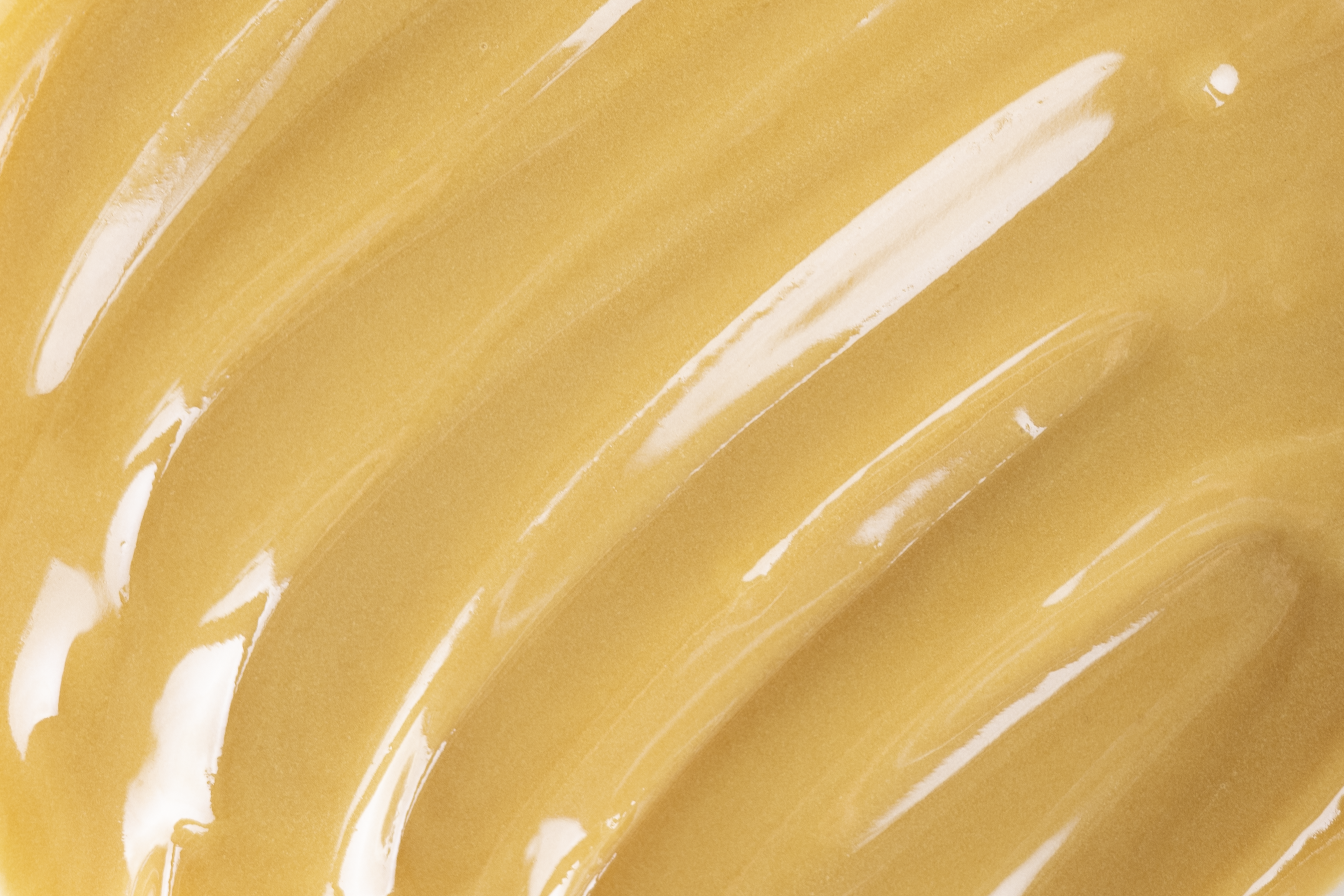 Close-up of creamy golden Manuka honey