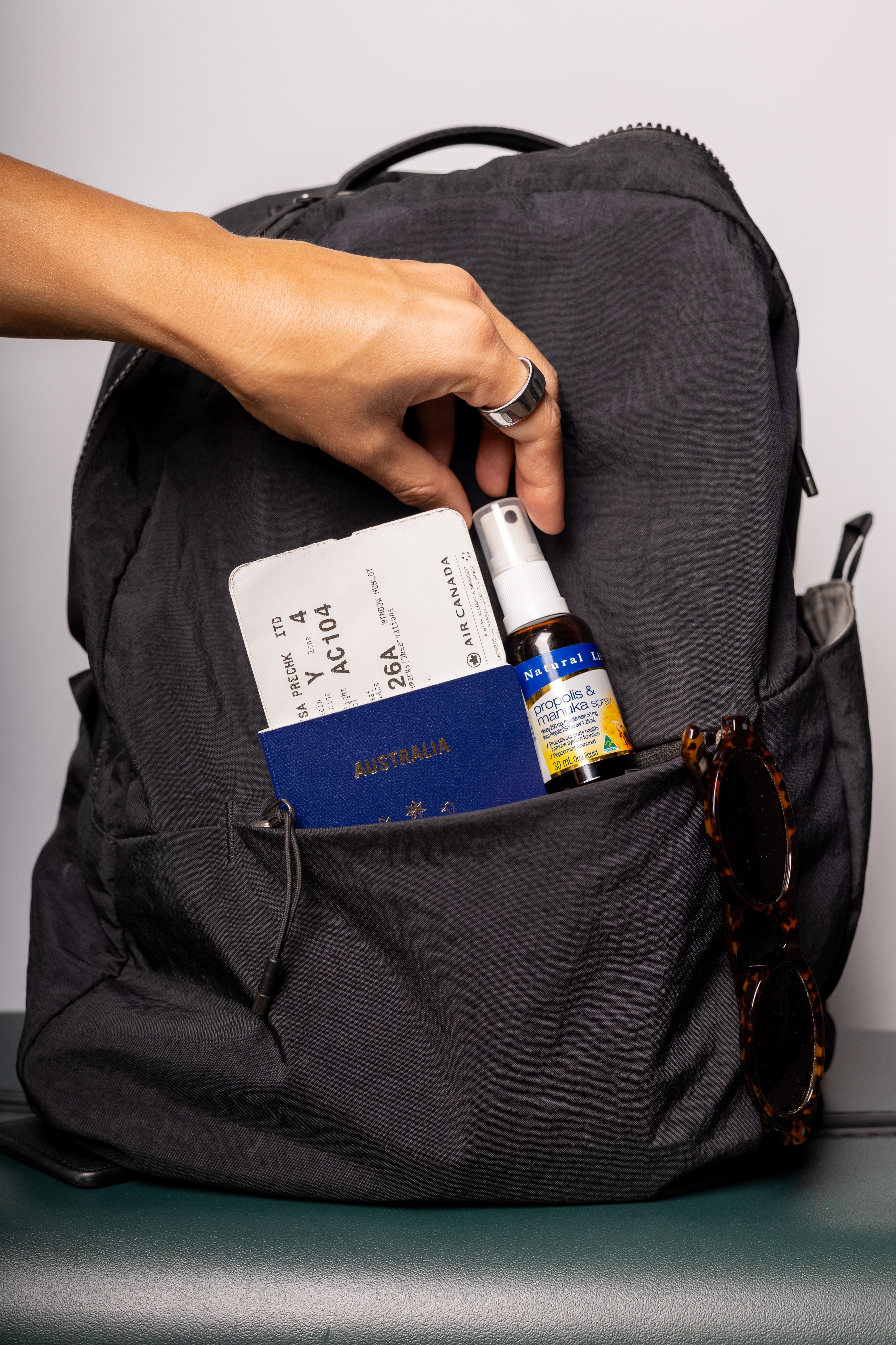 Throat spray tucked into a pack for trails and campsites