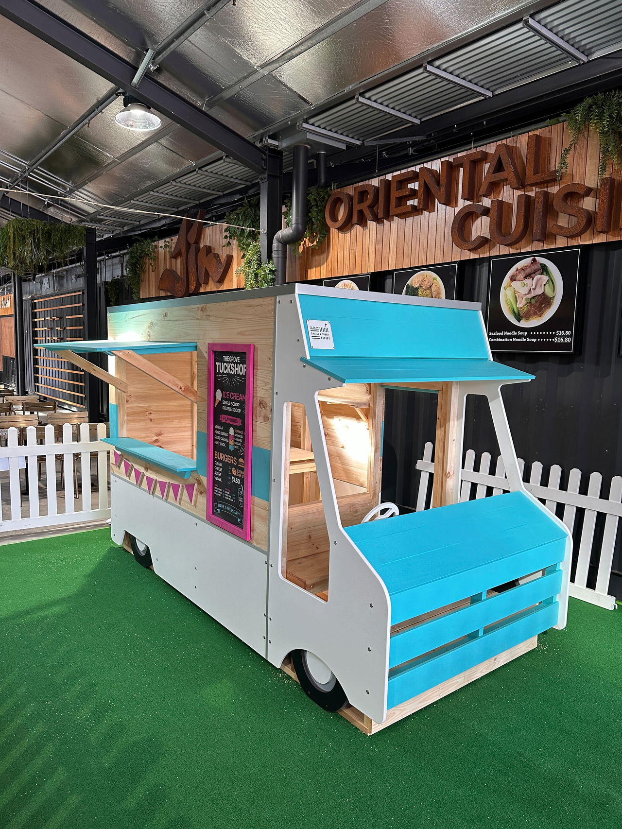 Side view of Food Truck Cubby House in shopping centre food court
