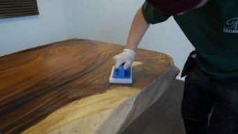 Wiping off the excess oil with a pad