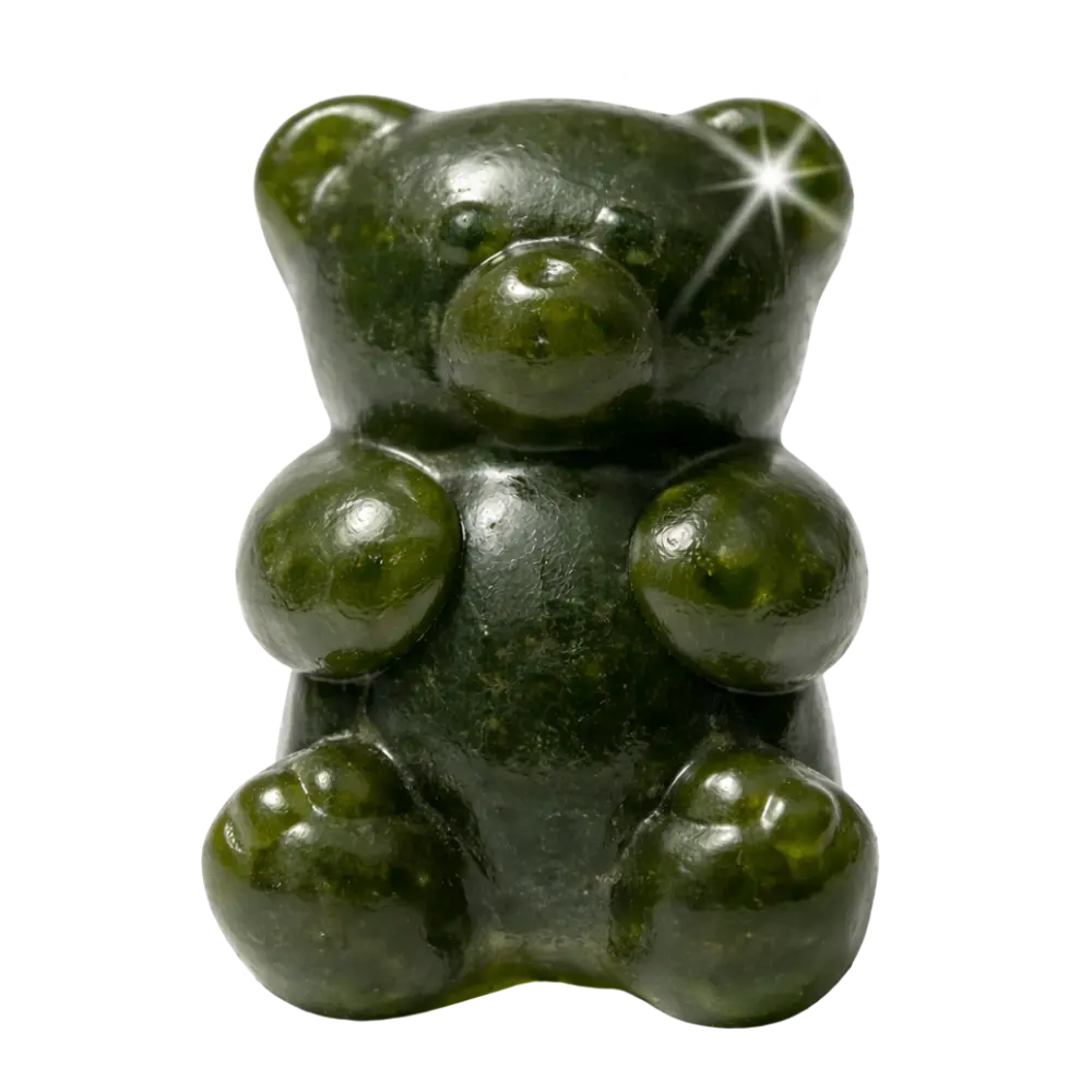 Dark green translucent gummy bear candy with shiny surface and highlights