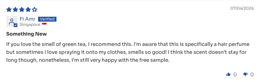 Verified customer review recommending the green tea scent, saying it smells so good she sprays it on her clothes too