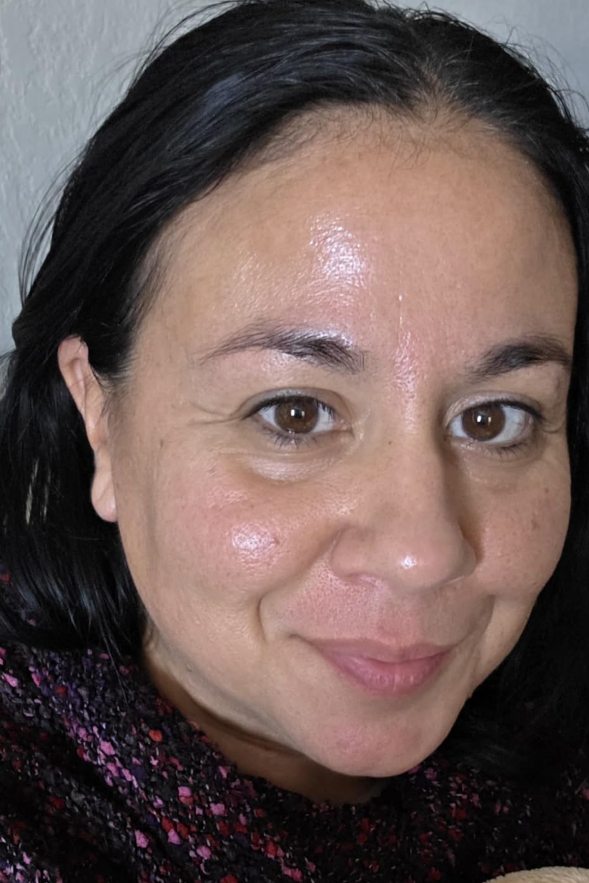 Kelly S. showing her dewy, glowing skin after using the toner