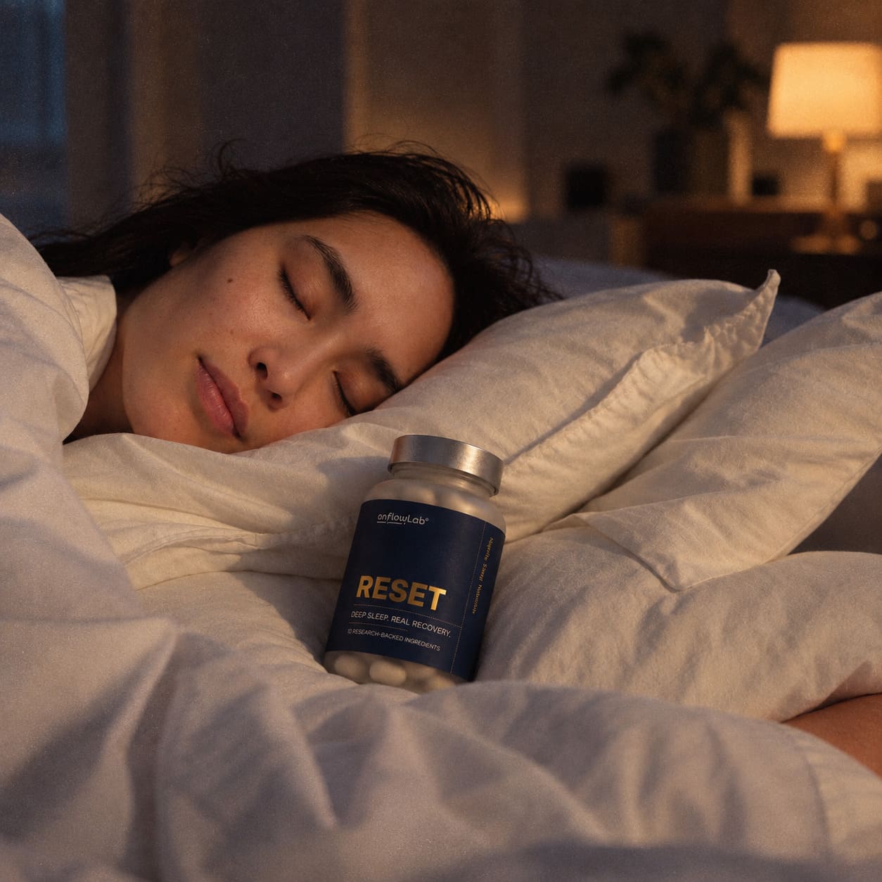 A woman holding a bottle of RESET™ before bed