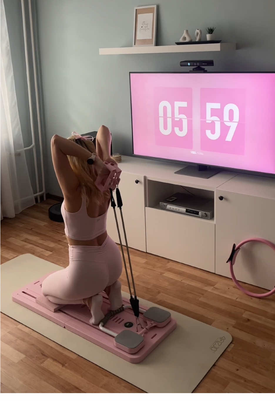 Woman doing Pilates on BonjourMUSE home board