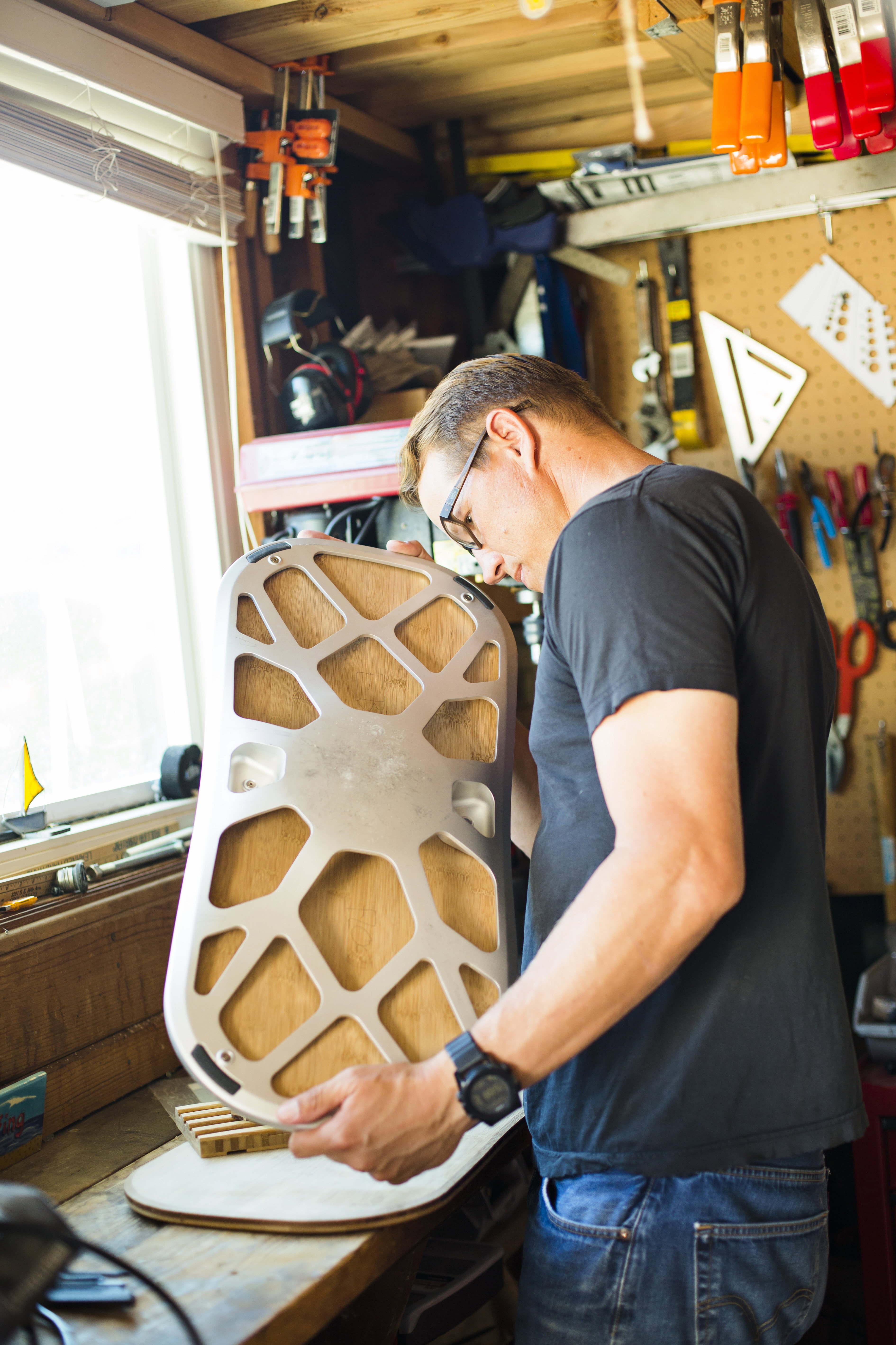 Craftsman assembling a balance board in the FluidStance California studio