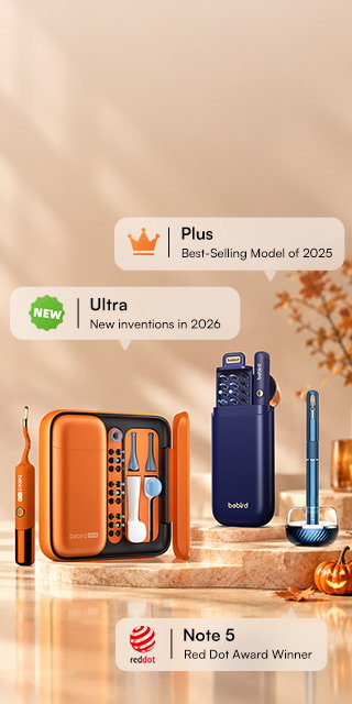 Bebird Ultra (new for 2026), Plus (best-selling model of 2025) and the Red Dot Award-winning Note 5 on marble pedestals with autumn leaves, a candle and a jack-o'-lantern