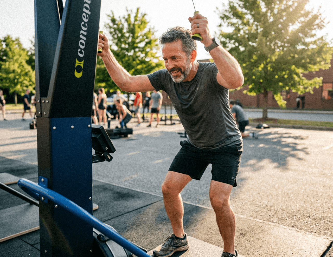 Man in his forties training outdoors on a ski-erg machine