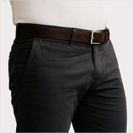 Person wearing dark pants, white shirt, and brown belt with a silver buckle.