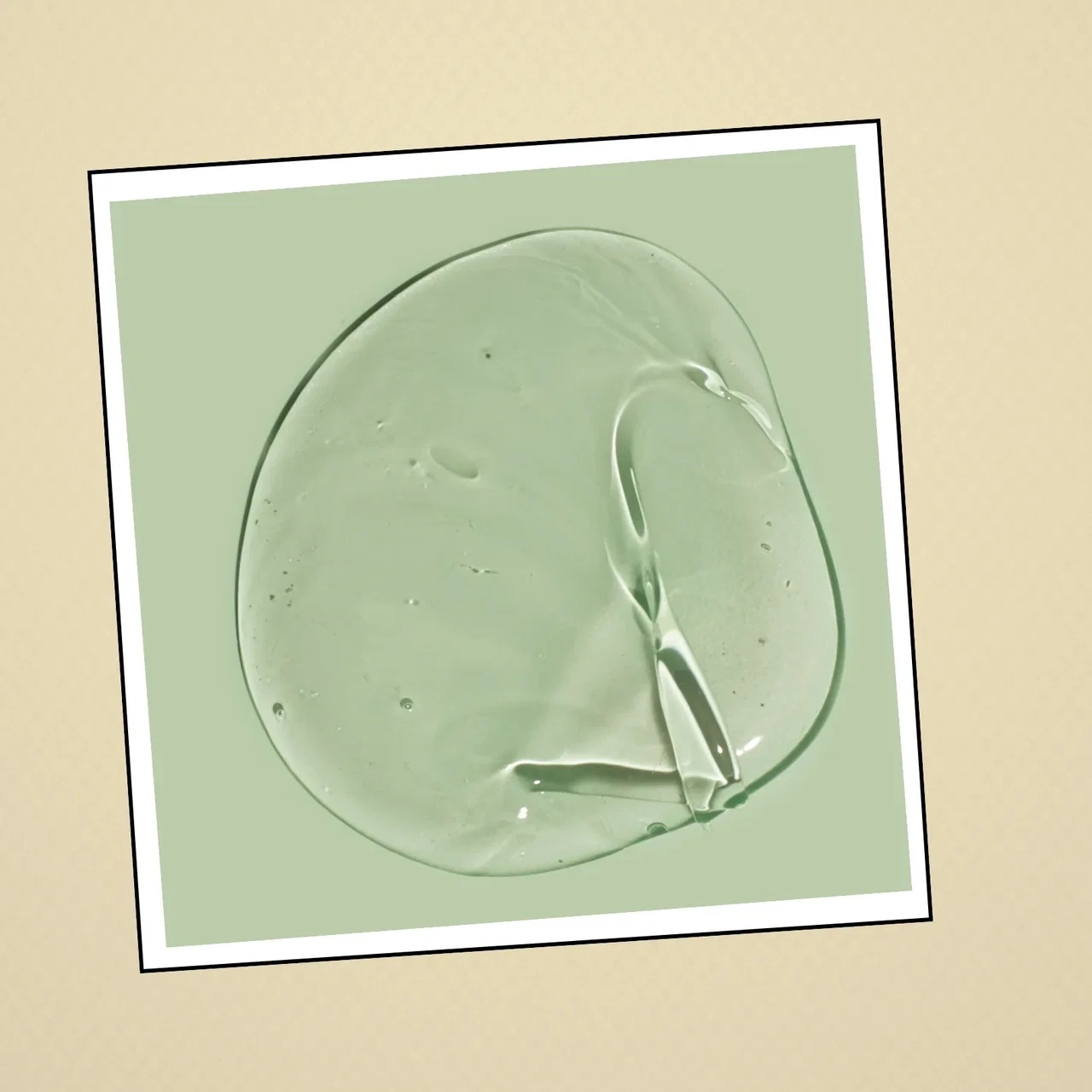 A smooth swirl of clear gel on a pale green background representing niacinamide.
