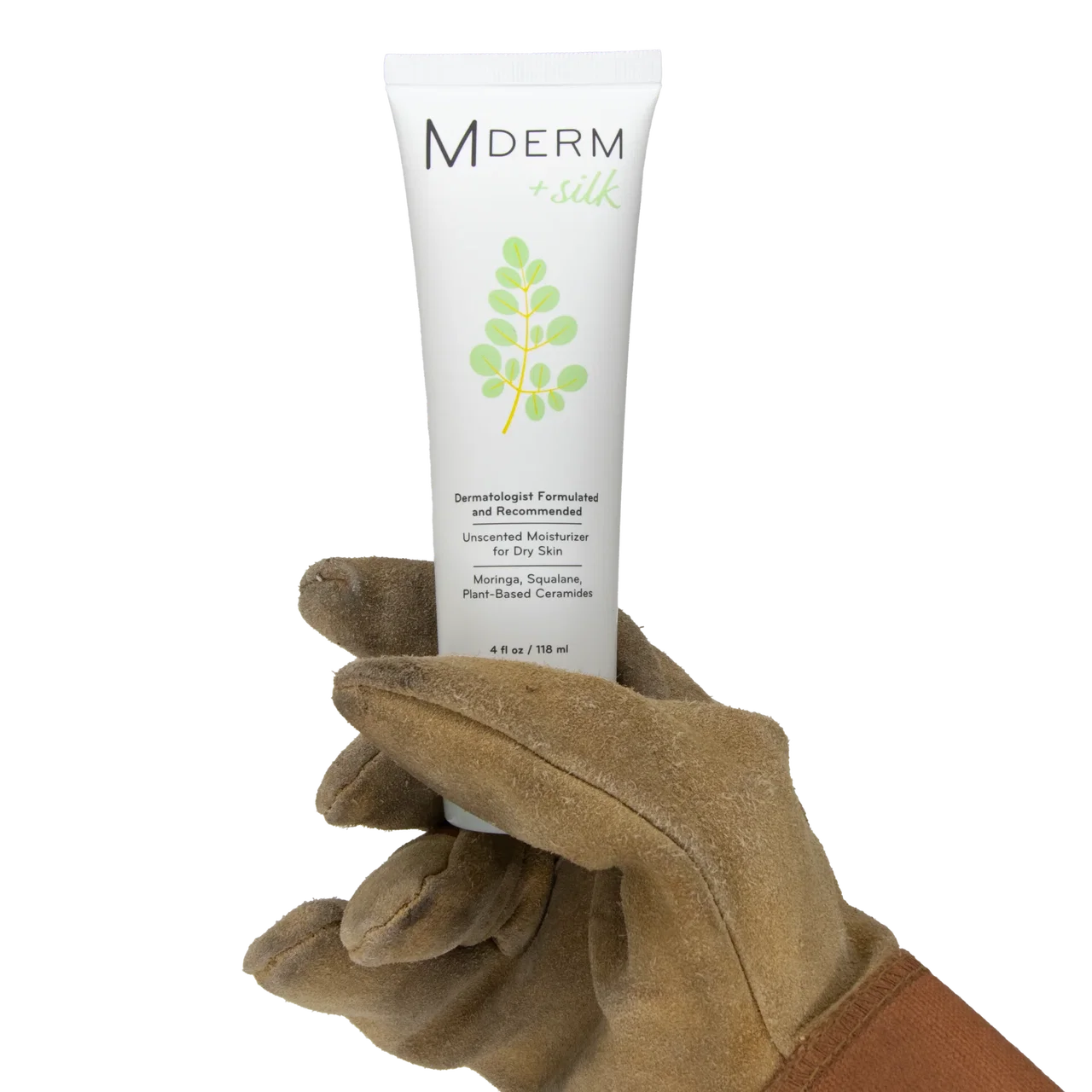 Suede work glove holding a 4 oz tube of MDERM +silk unscented moisturizer for dry skin.