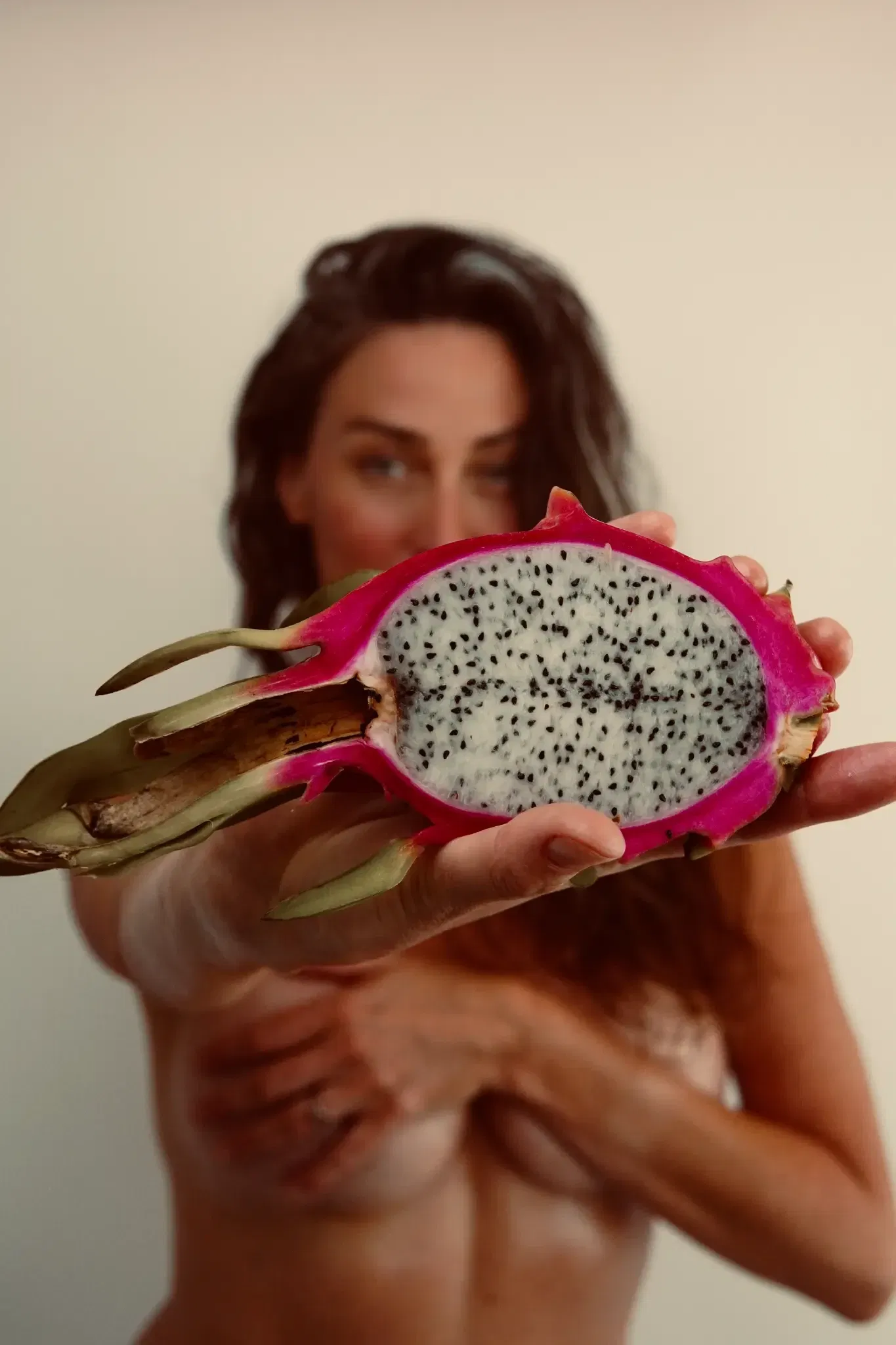 Samantha with exotic fruits representing natural wellness and nutrition for menopausal health