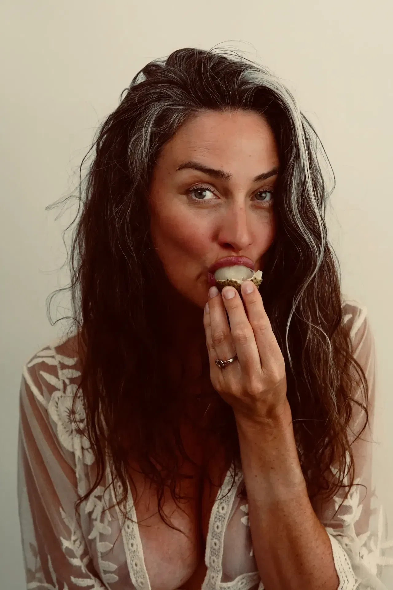 Samantha tasting wellness cream product representing mindful nutrition for hormonal health