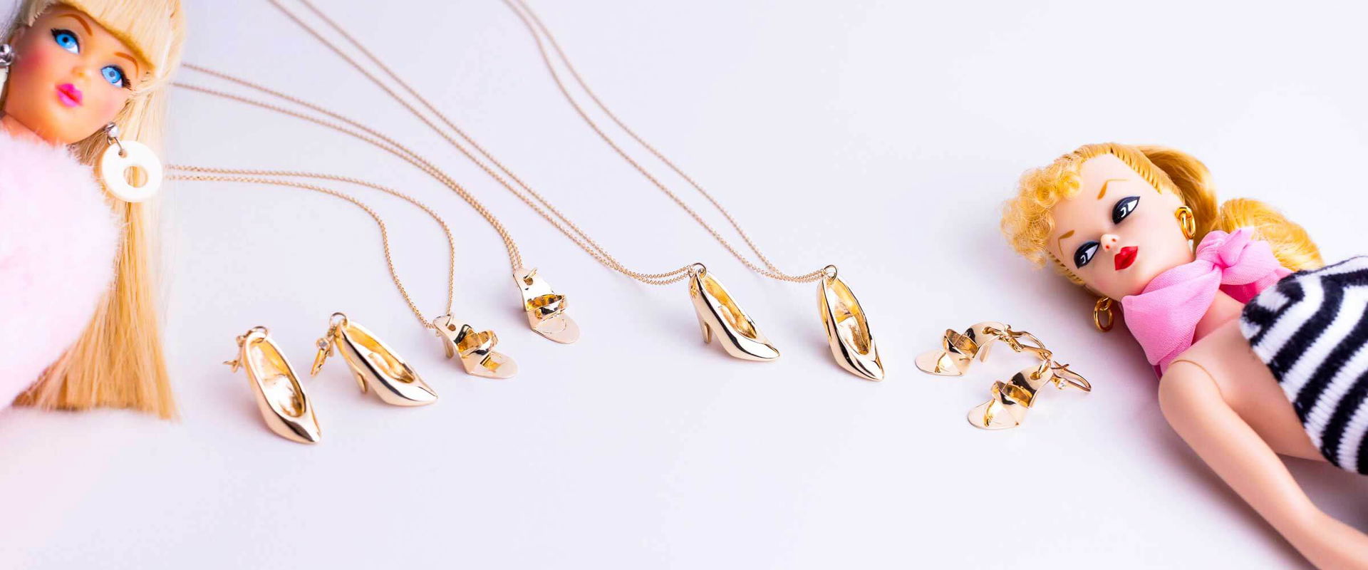 Barbie-inspired gold high-heel & sandal charm necklaces and earrings designed by Sara Gallo Custom Jewelry.	