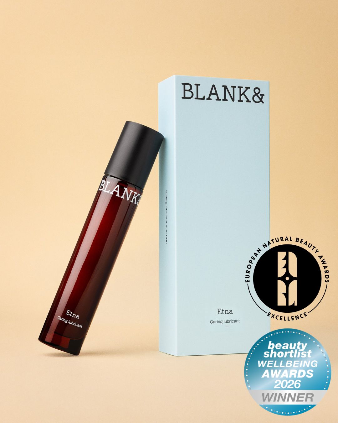 Etna bottle next to its light blue box