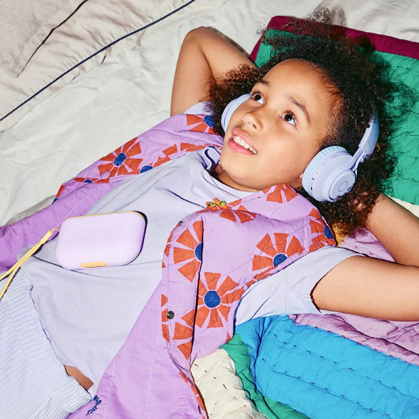 Girl dancing while listening to her NODI Flip