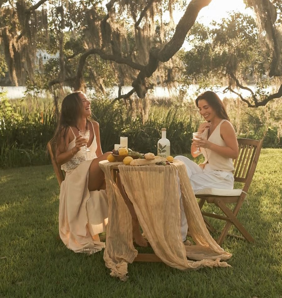 Friends sharing Kava Haven at an outdoor table