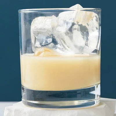 Kava Haven served over large ice cubes in a rocks glass