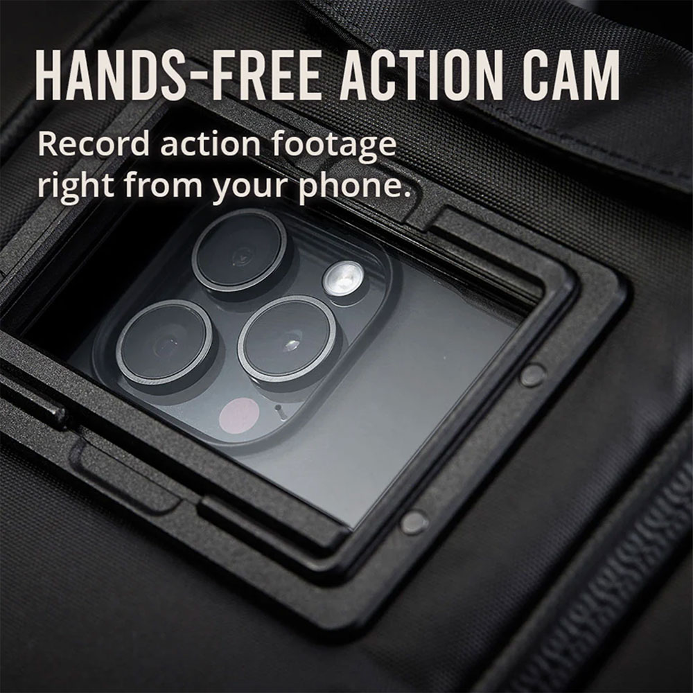 Hands-free action cam: a phone's rear cameras looking out through the front window of a black West Slope chest pack to record footage