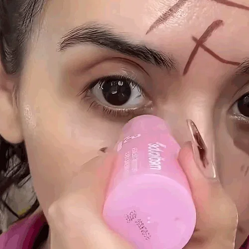 Applying the balm stick under the eye without touching the skin