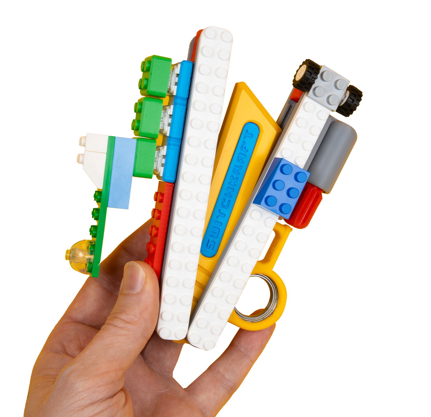Brickmod Expansion in hand: a kARTIFACT covered in colorful brick-compatible pieces