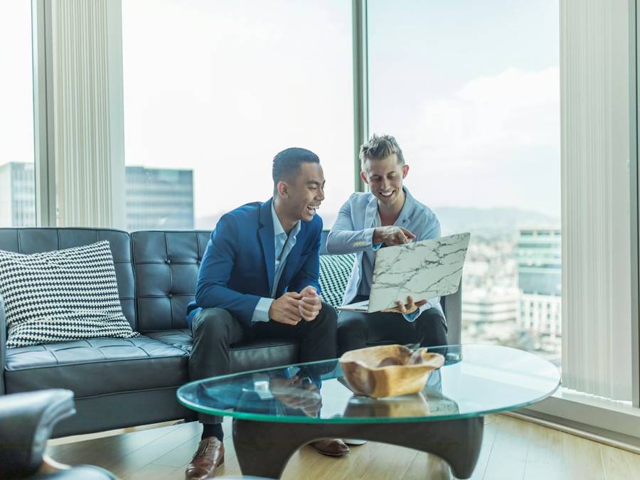 Sales rep reviewing plans with a client