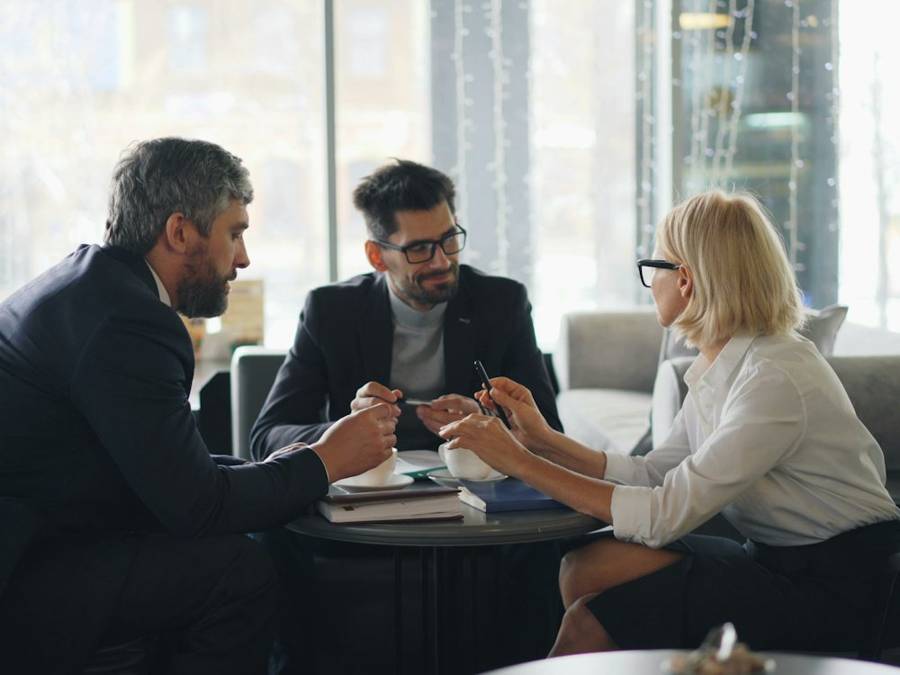 Lawyers meeting a client at a table