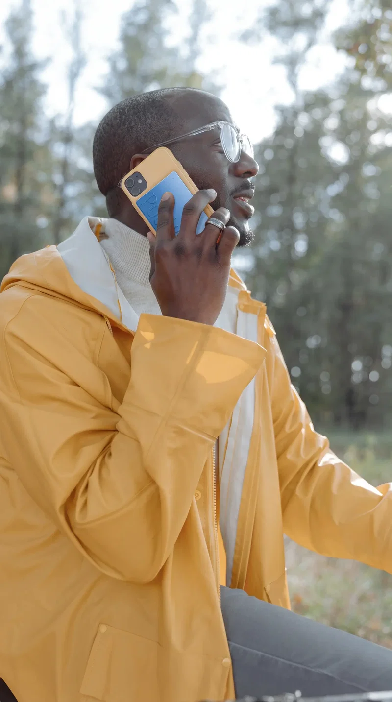A man outdoors on a phone call