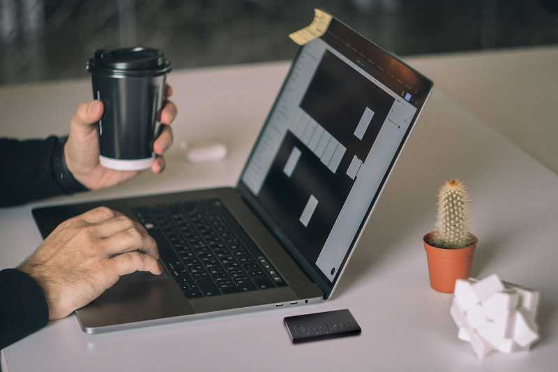 Pocket on a desk next to a laptop