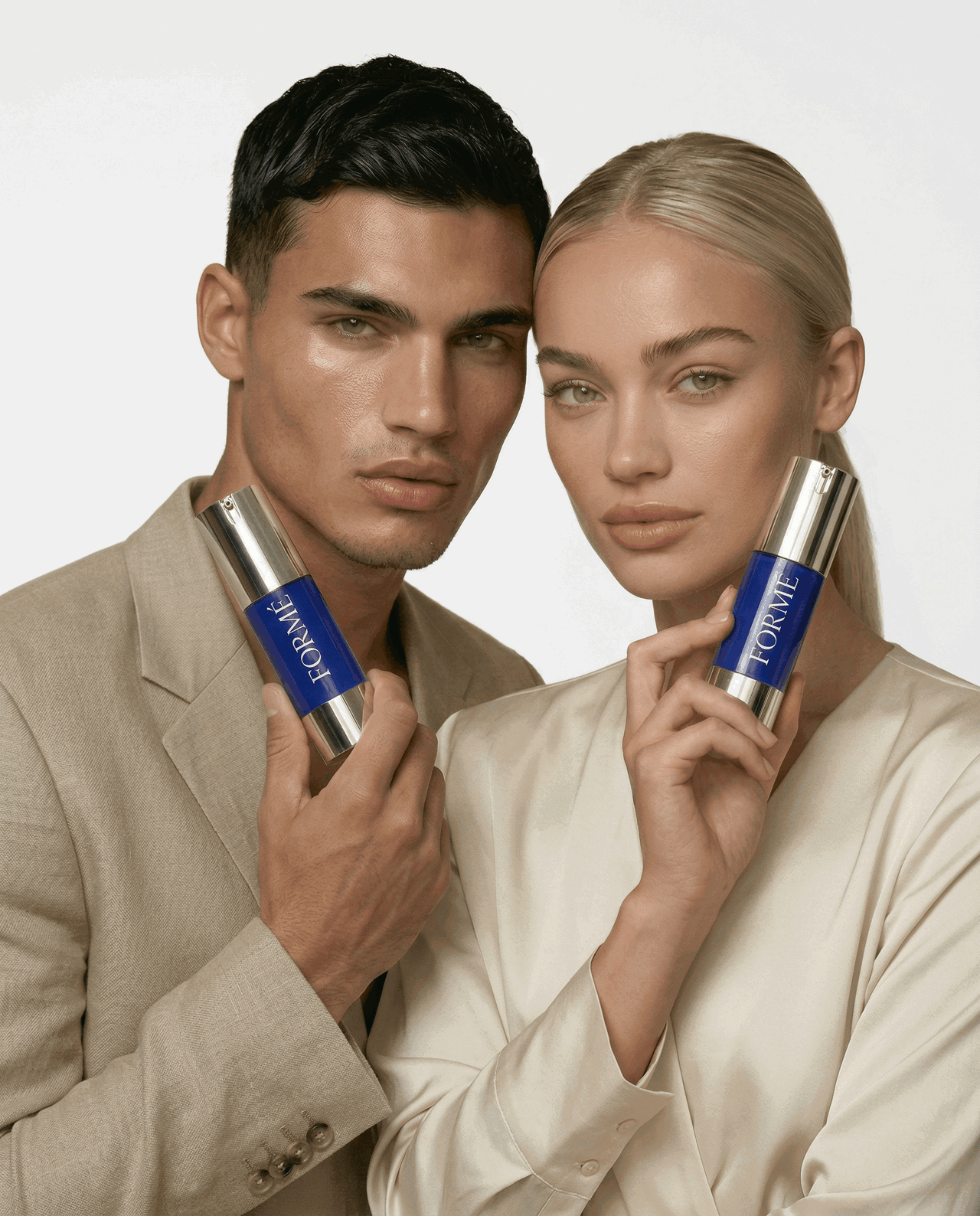 Models holding Formé copper peptide serum for healthy looking skin