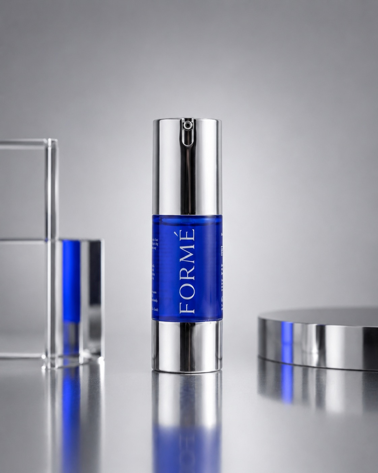 FORMÉ copper peptide serum bottle in cobalt blue with chrome pump on white stone surface, luxury skincare studio shot