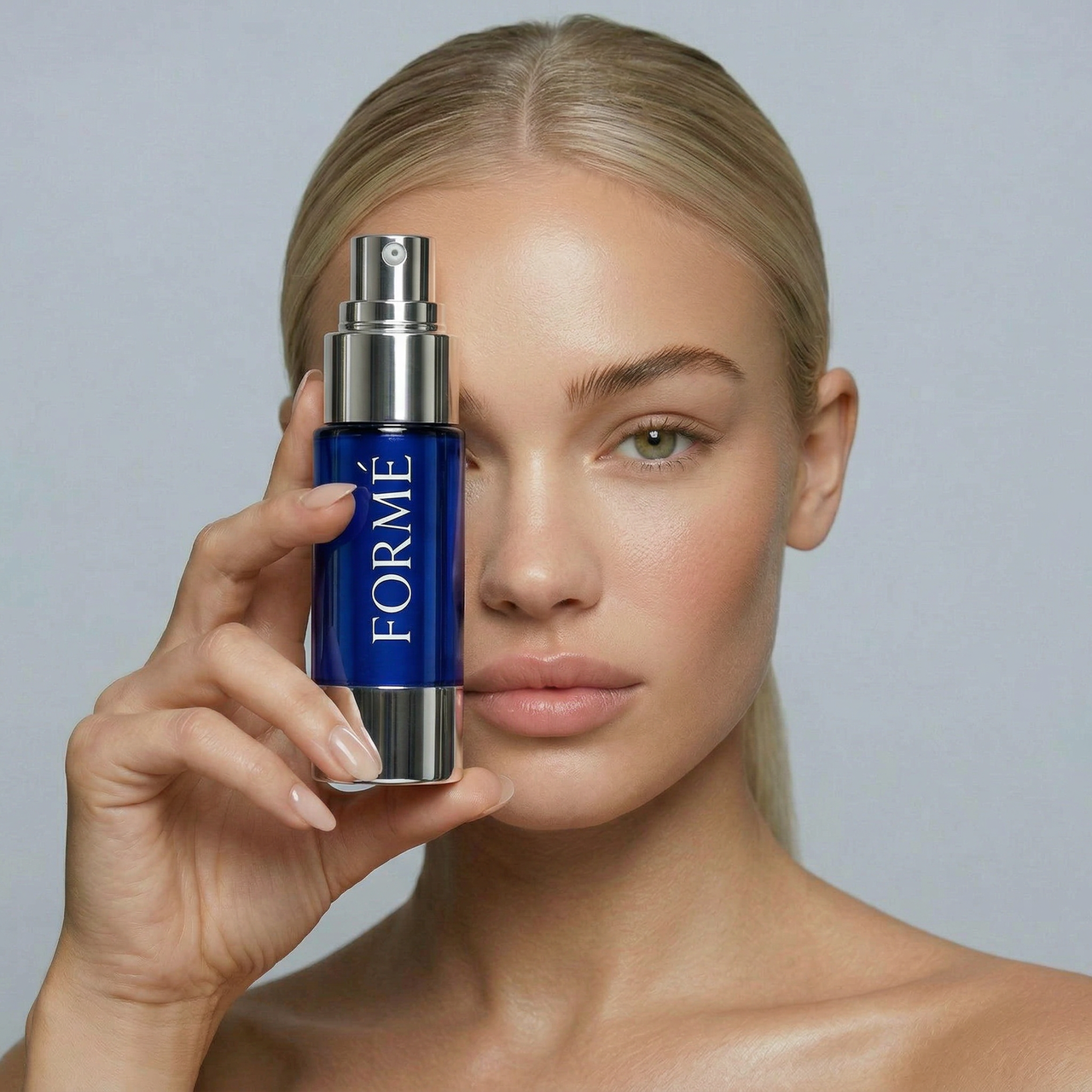 Woman applying Formé copper peptide serum for smoother looking skin