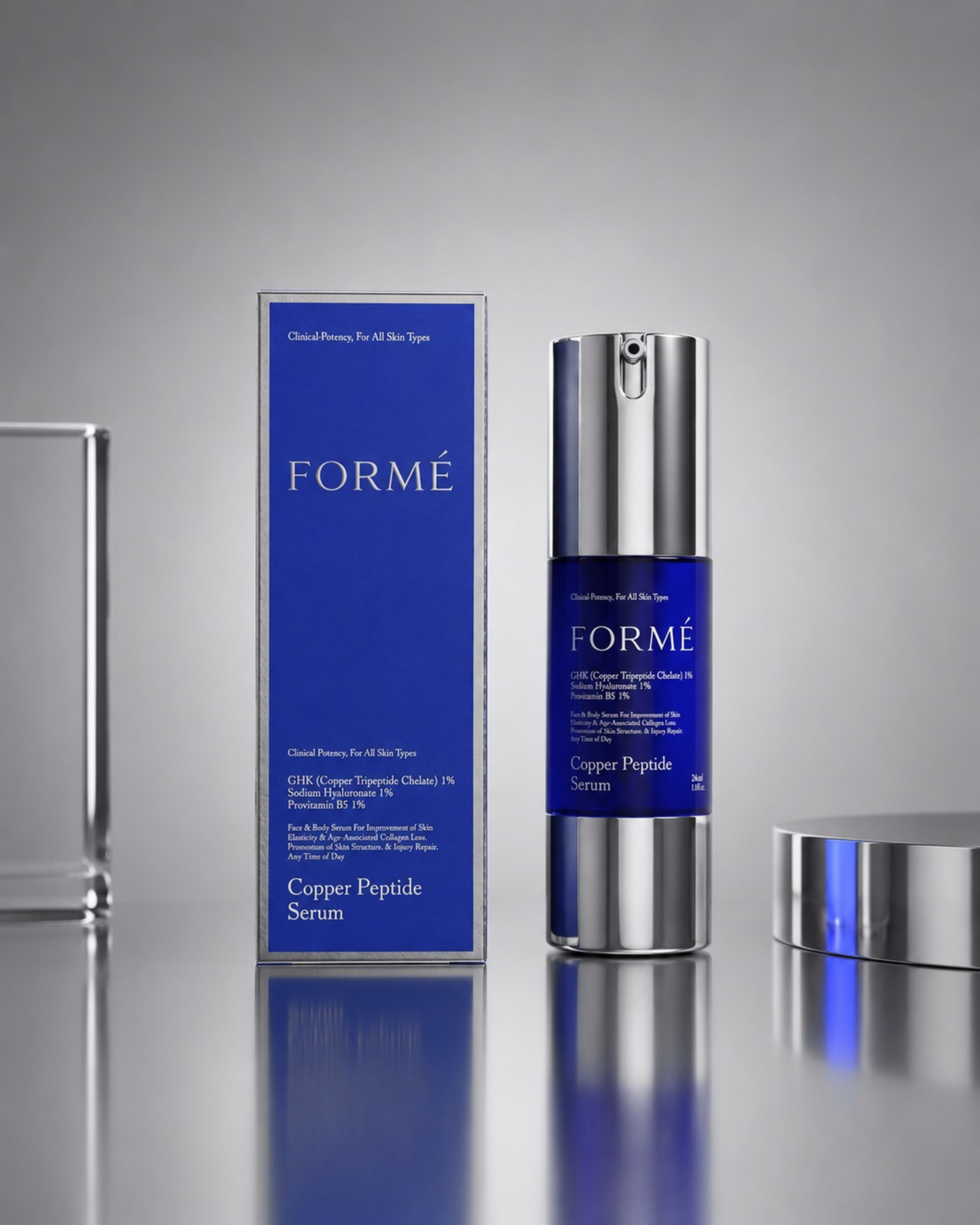 FORMÉ serum bottle with matching cobalt blue packaging box, minimal luxury skincare flat lay