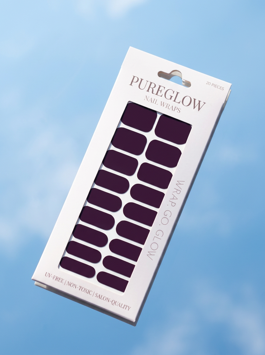 Box of Pureglow nail wraps with dark purple color against a blue sky background