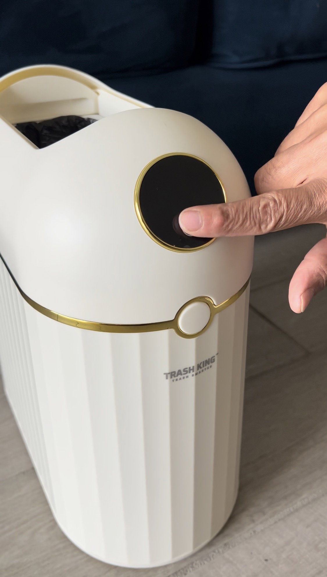 Finger pressing the Crown 10L touchscreen to seal the bag