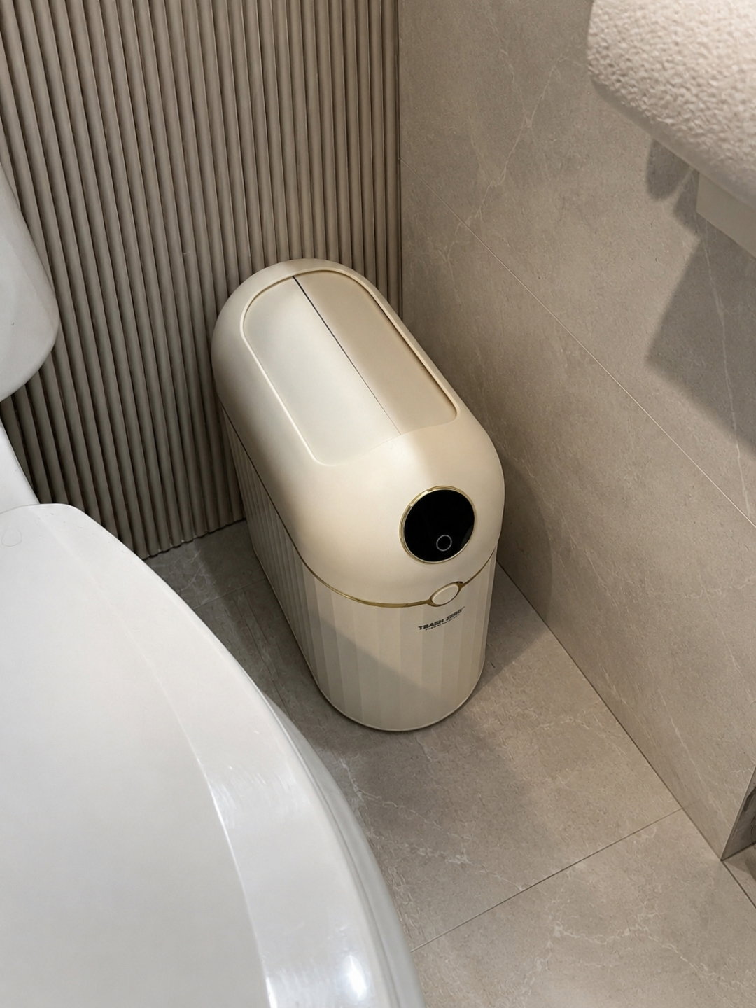 Crown 10L bin tucked into a tight bathroom corner