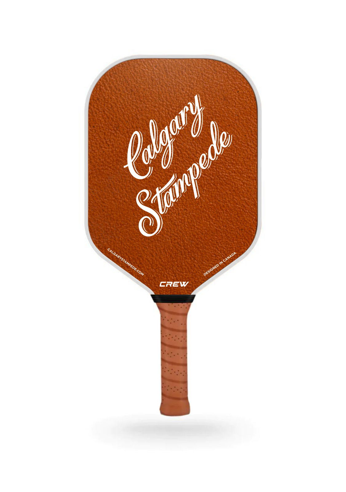 Brown pickleball paddle with &quot;Calgary Stampede&quot; text and textured handle.