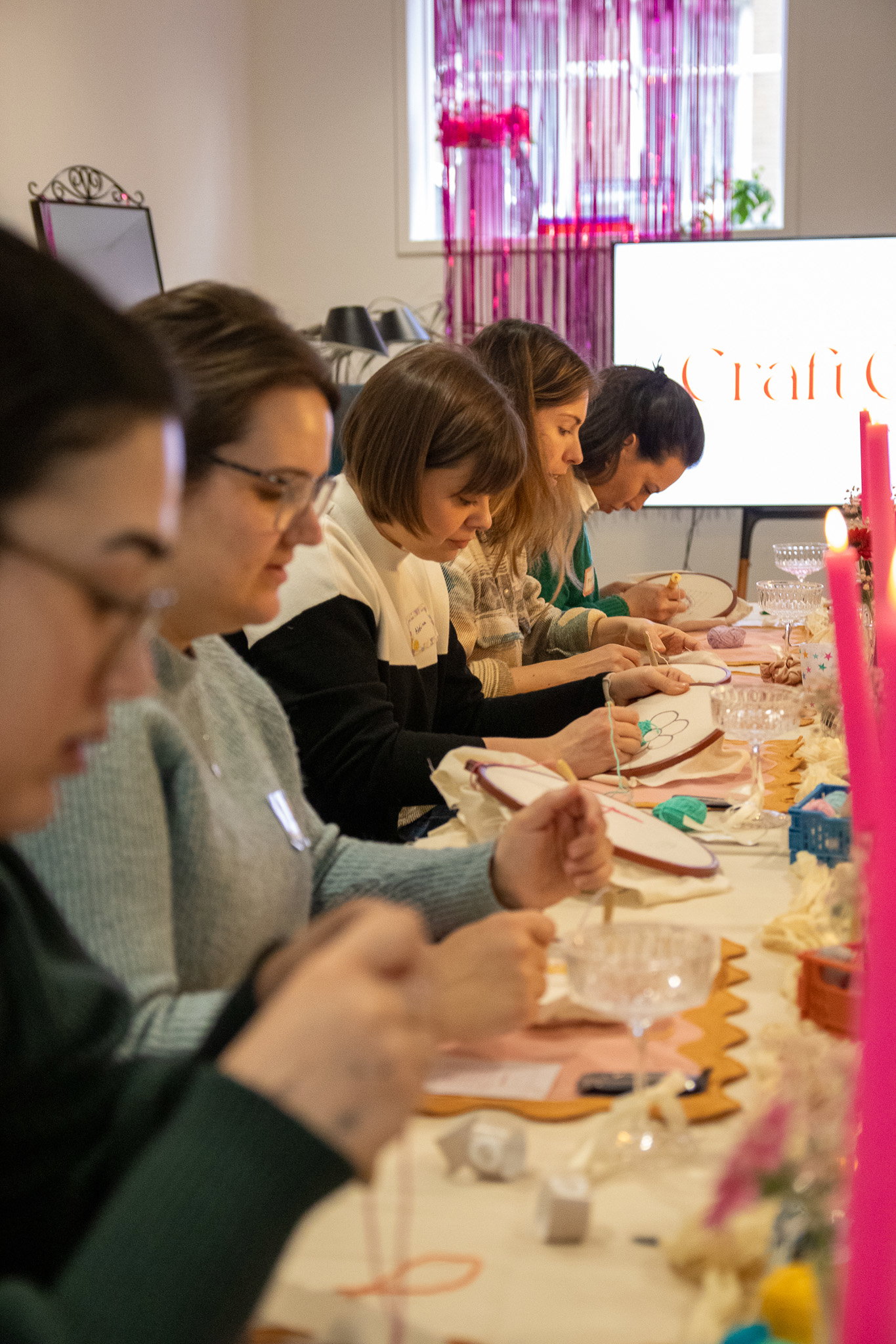 A workshop host explaining a technique to a small group