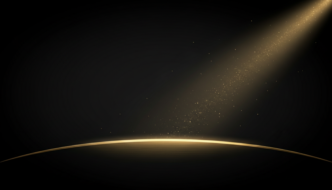 Champagne gold light sweeping across a dark studio backdrop