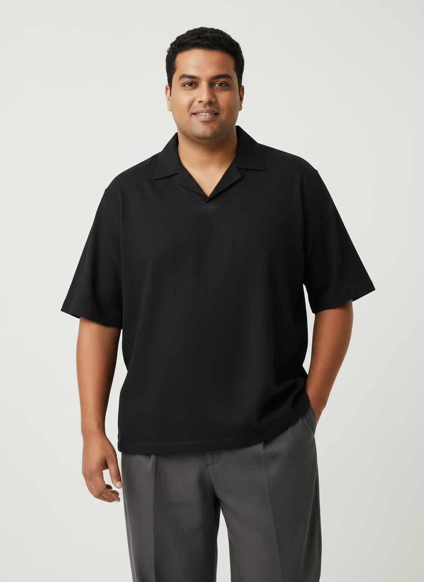 Plus size model in a relaxed black shirt
