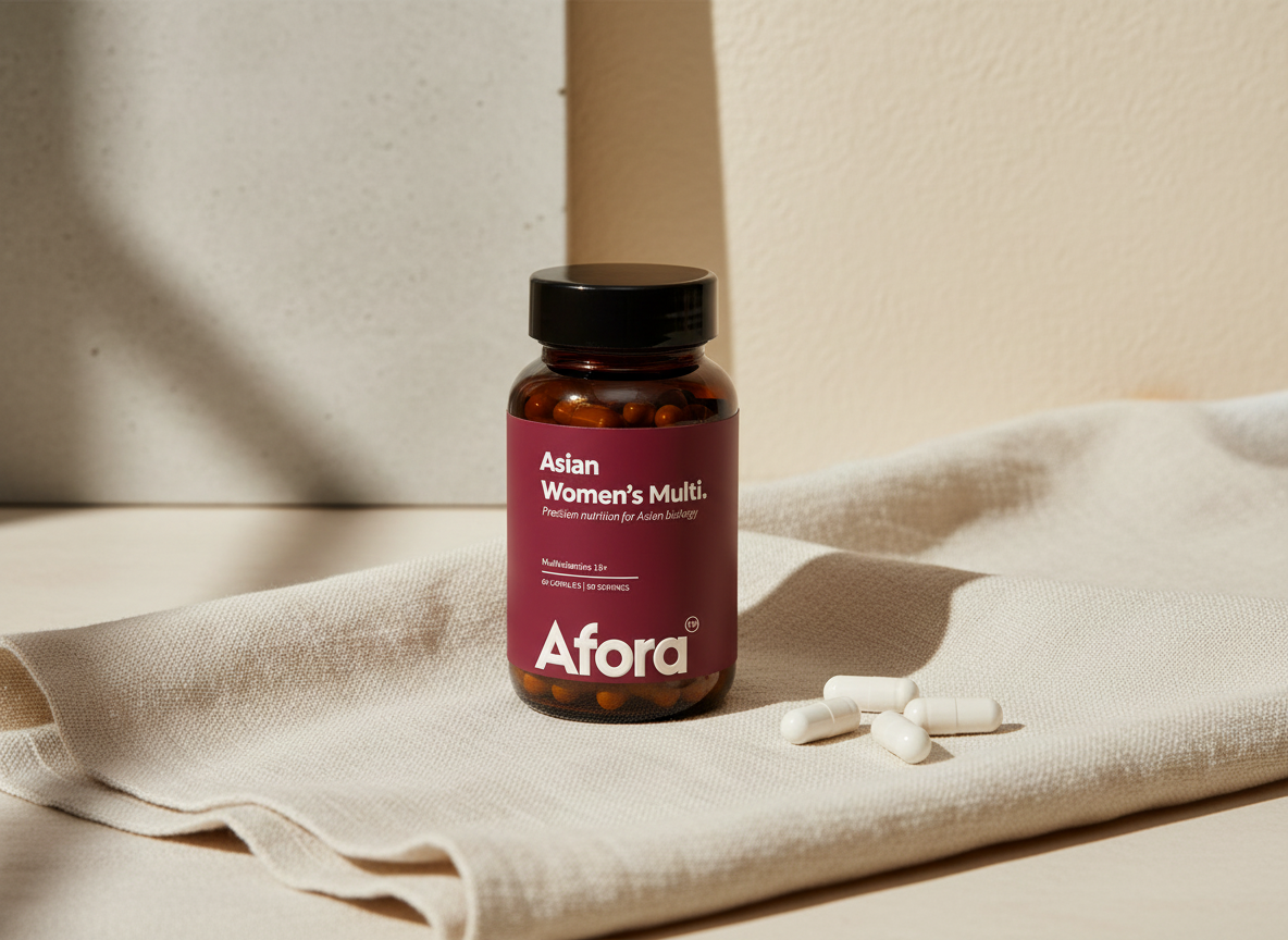 An amber glass Afora™ bottle on ivory linen with plain white capsules beside it