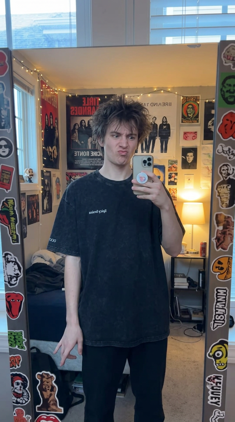Mirror outfit check in the Stay Weird oversized tee