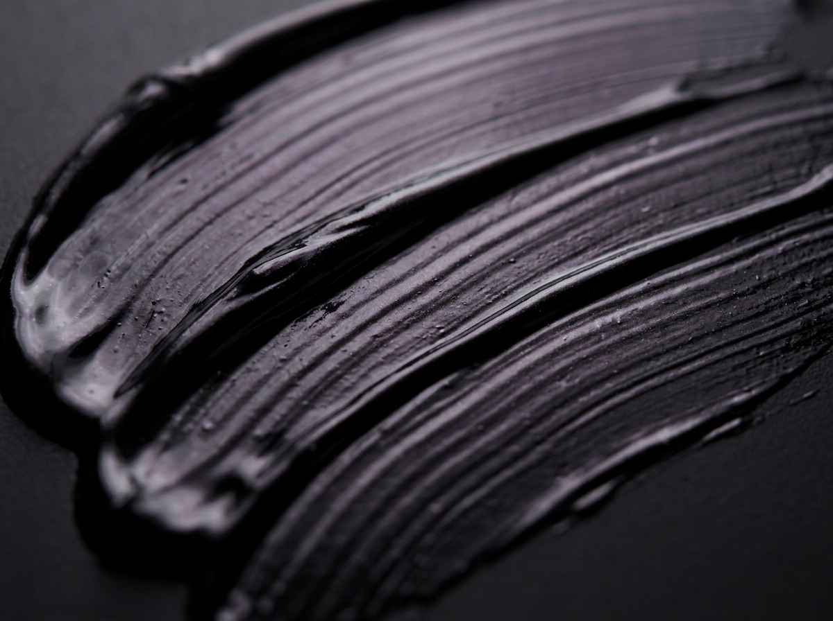 Close-up of the silky, glossy black VolumeCare+ mascara formula