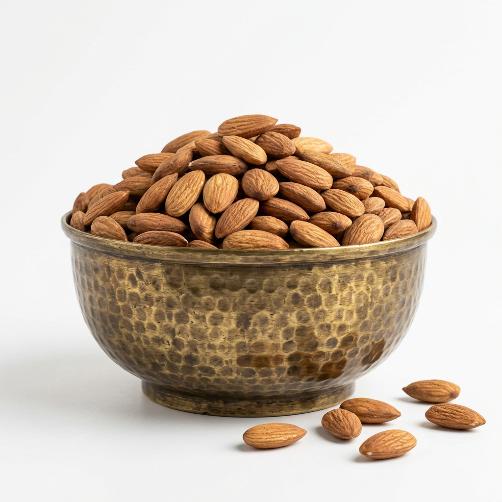 Brass bowl of whole almonds