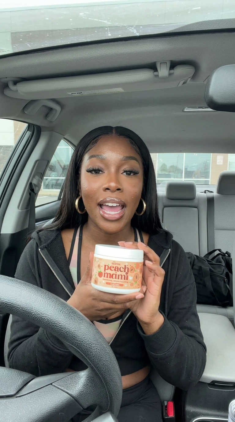 Car review holding Peach Mami up to the camera