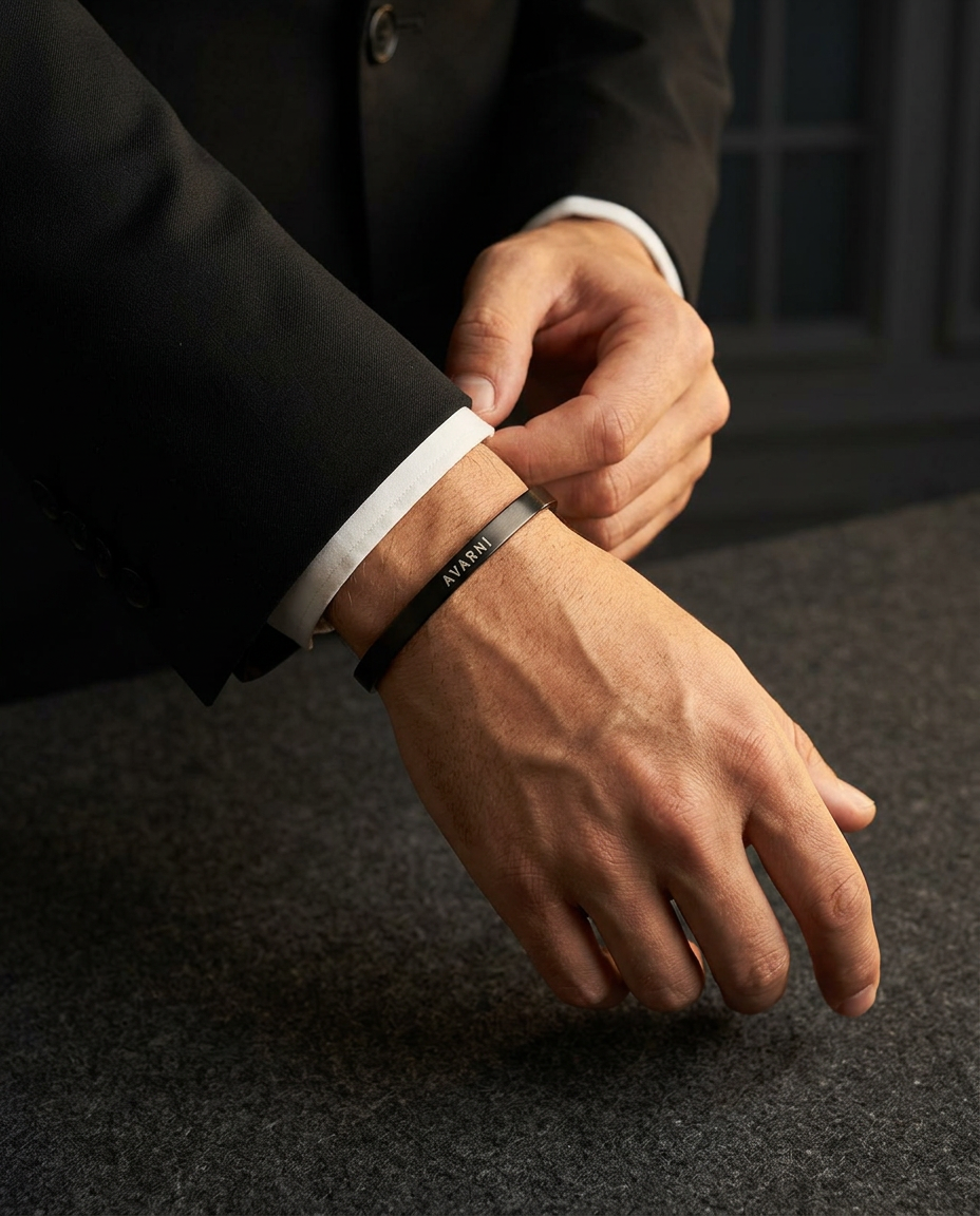 Man in a tailored suit wearing the black Avarni cuff