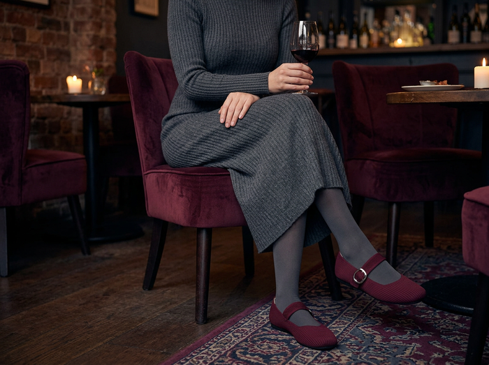 Rich Burgundy Mary Jane comfort flats worn with a knit dress at a wine bar