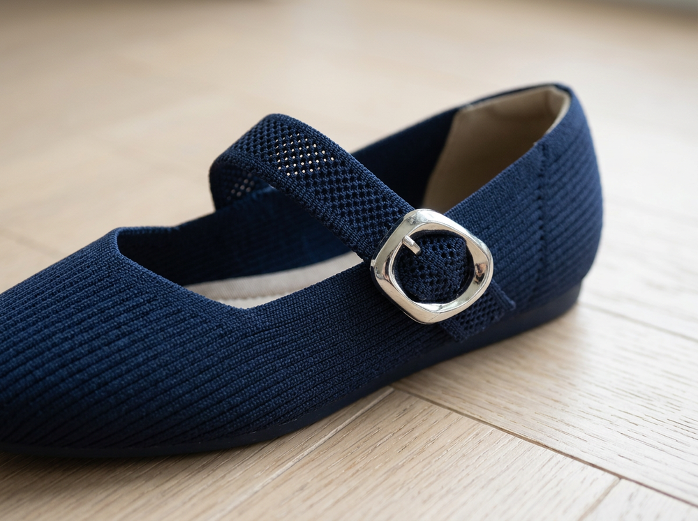 Close-up of the Midnight Navy ribbed knit, breathable strap and silver buckle