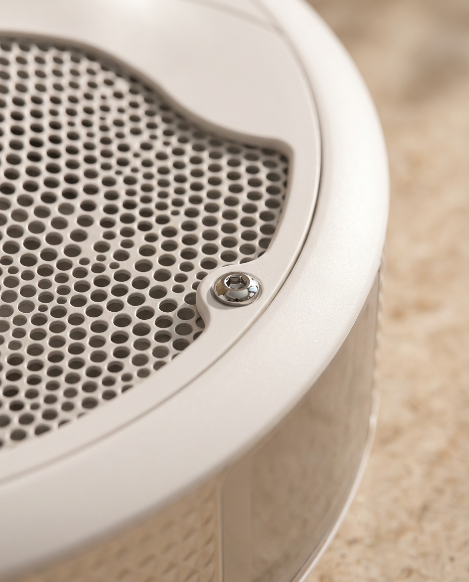 Detail of the AUVRAYA Air's perforated top plate and polished chrome fixing